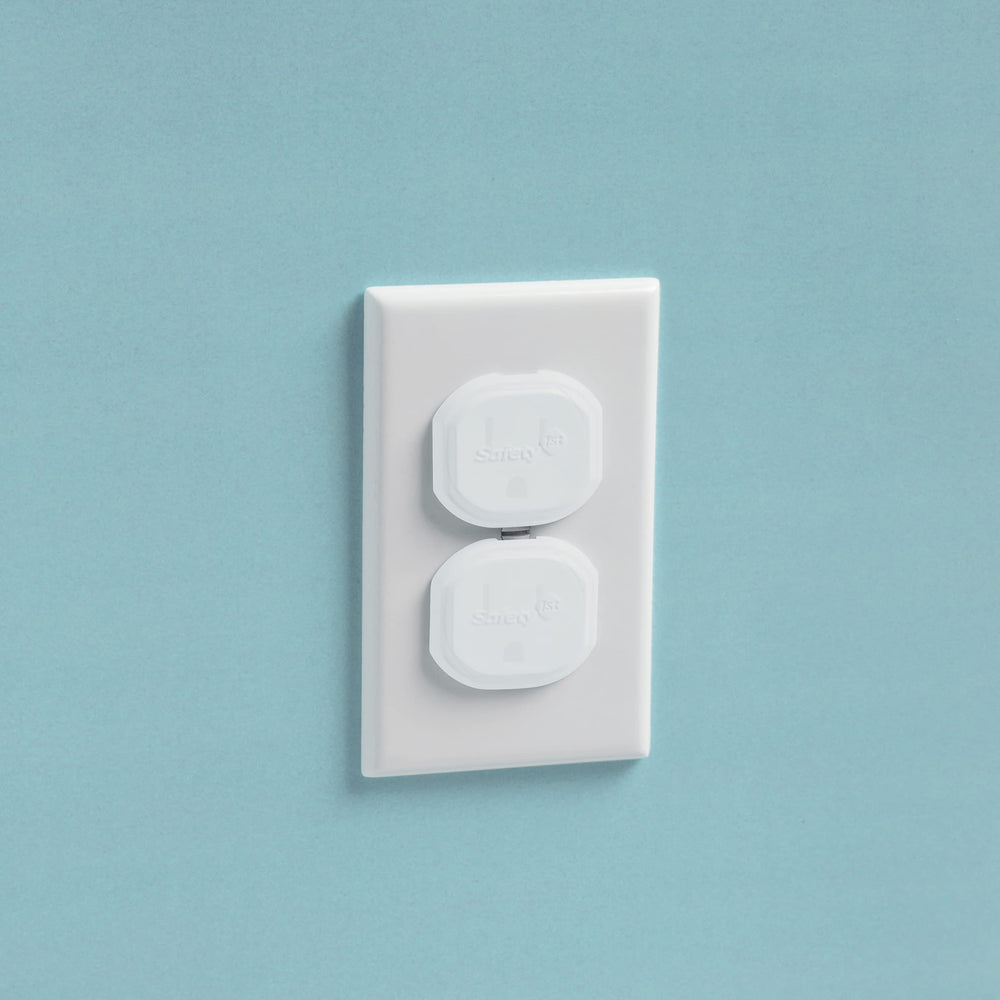 Safety 1st Secure Press plug protectors installed on outlet show a low-profile safety solution.