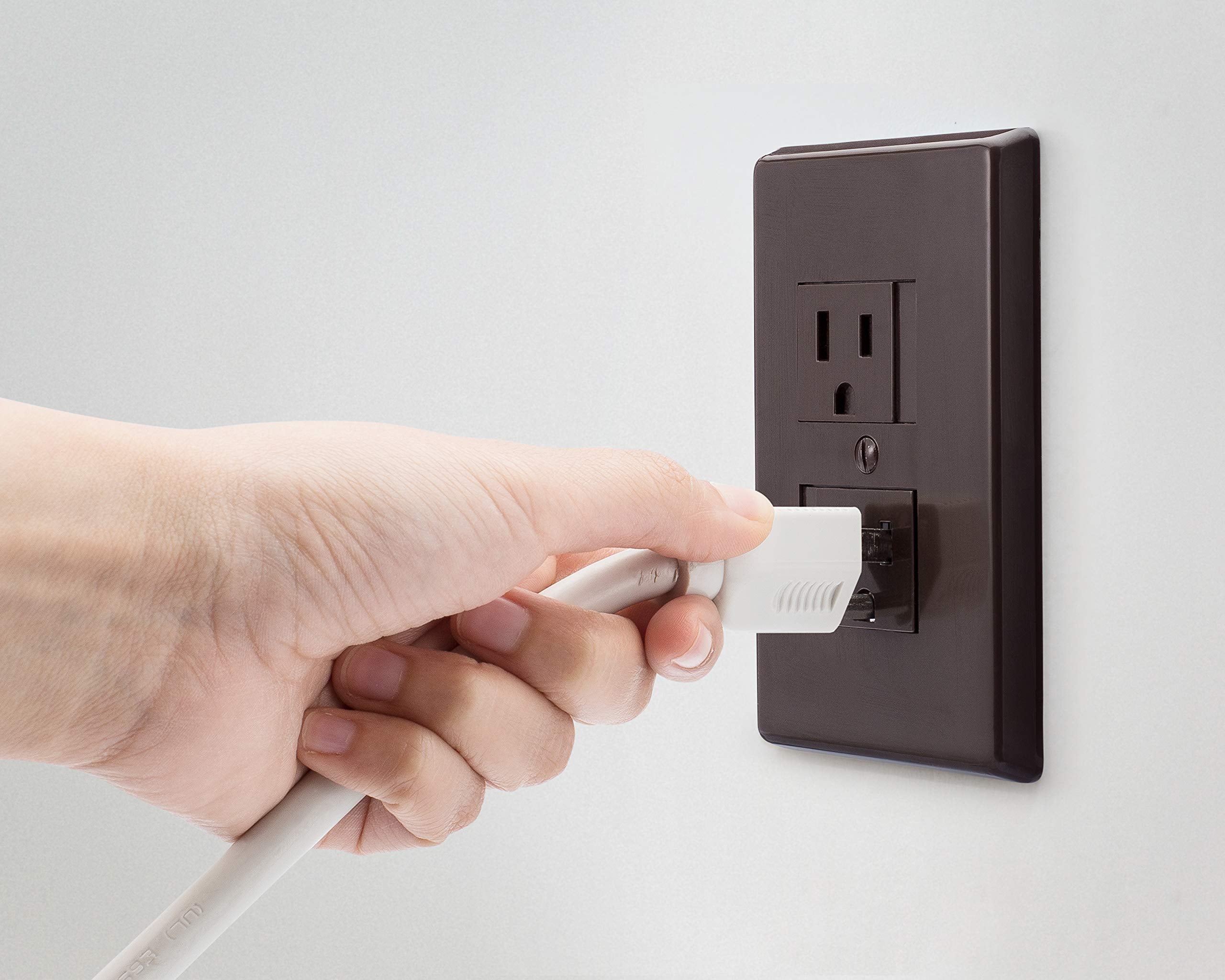 Safety Innovations espresso outlet cover close-up shows durable spring mechanism.