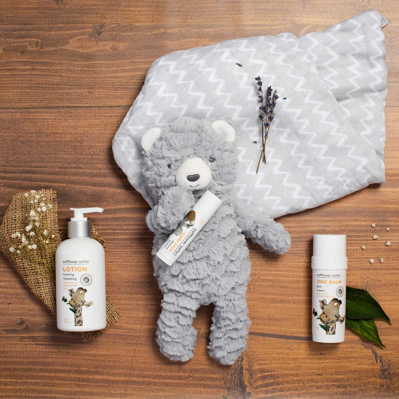 Safflower Safari diaper-area-application swirl on skin highlighting protective zinc-balm layer.