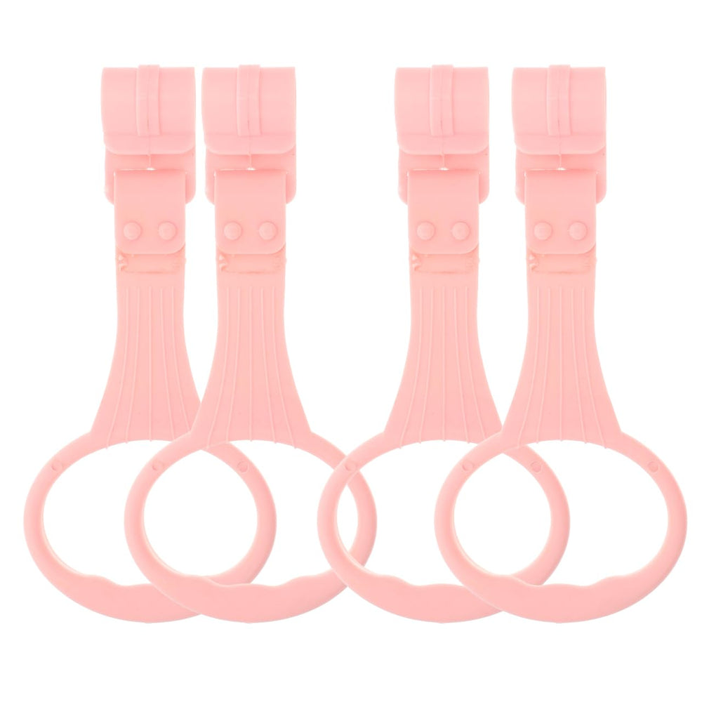 SAFIGLE pink pull-up ring on crib aids early standing exploration.