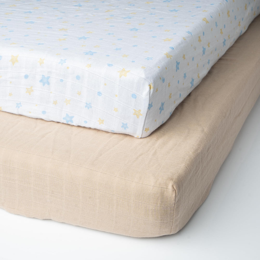 Salt Earth muslin crib sheet 2-pack with elastic edges ensures a secure, slip-free fit.