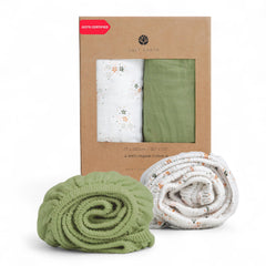 Salt Earth muslin crib sheet with green star design offers snug fit and breathable comfort.