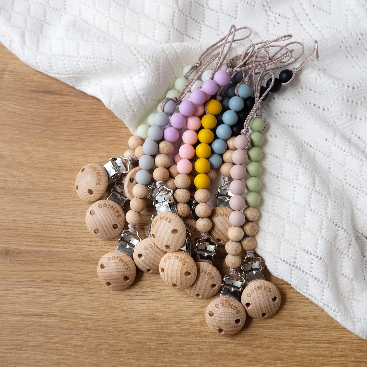 SAMiGO baby accessory keeps pacifiers close for parent peace of mind.