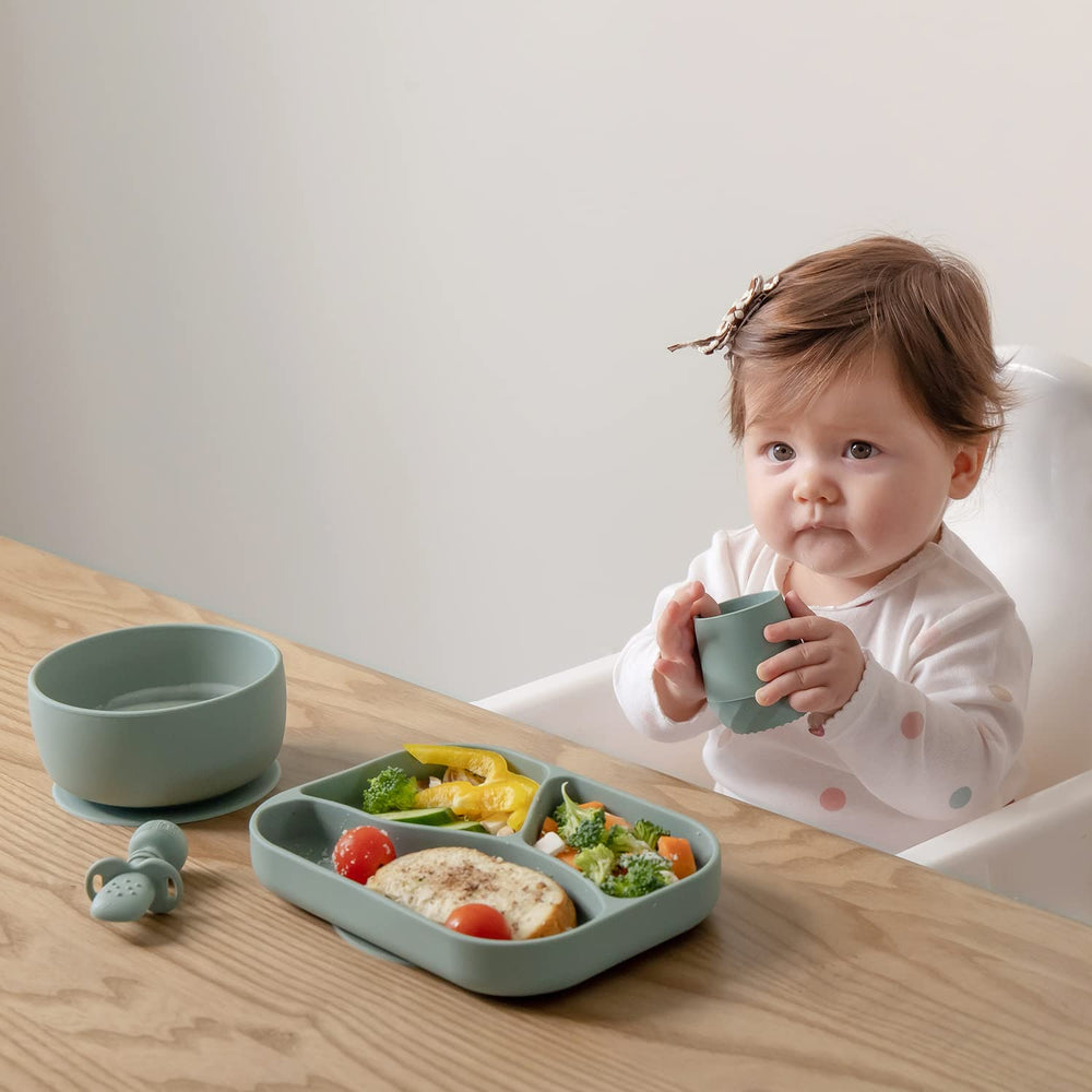 SAMiGO baby cup shows textured grip for secure handling by caregivers.