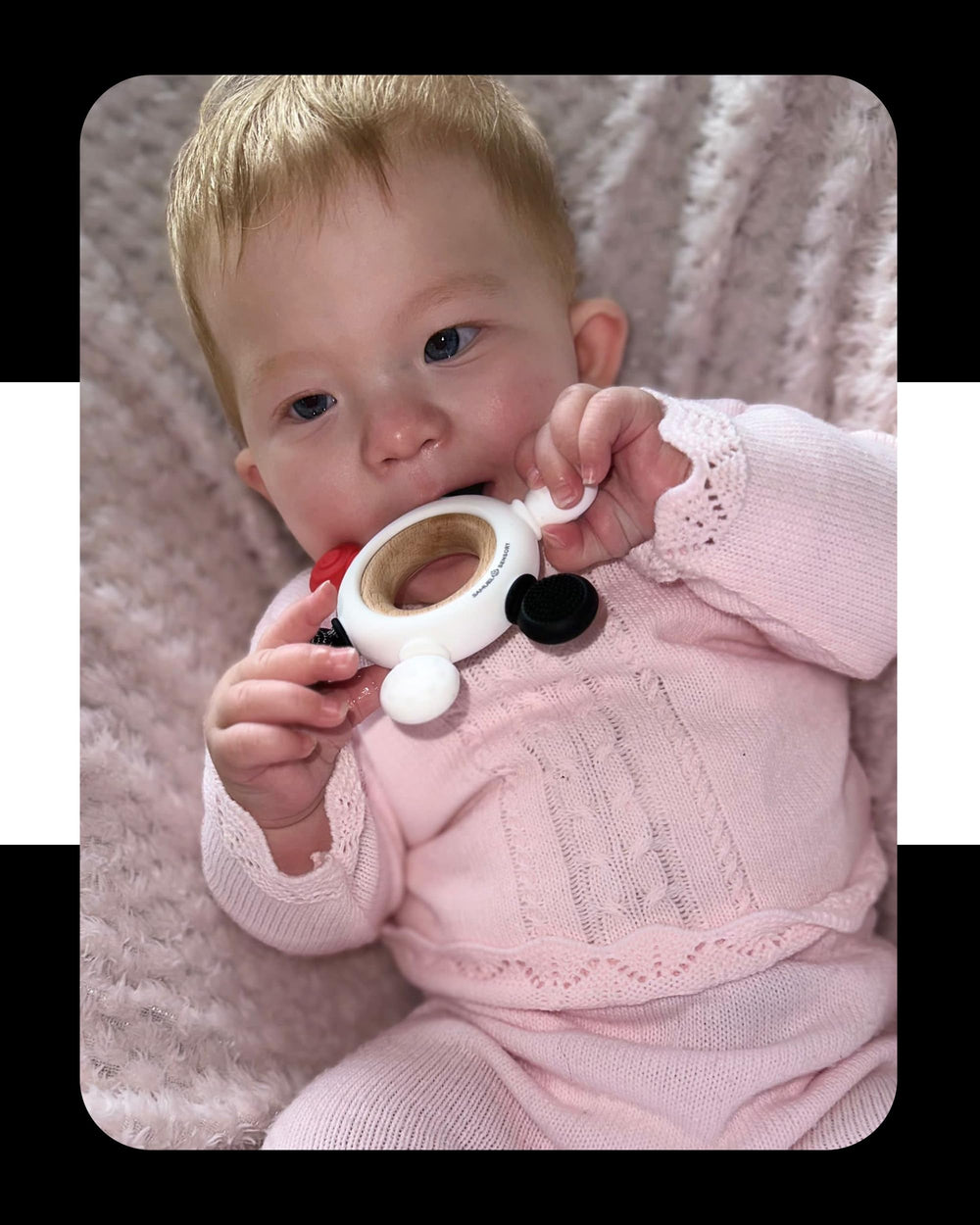 Samuel Sensory teether ring in car seat or stroller for travel comfort.