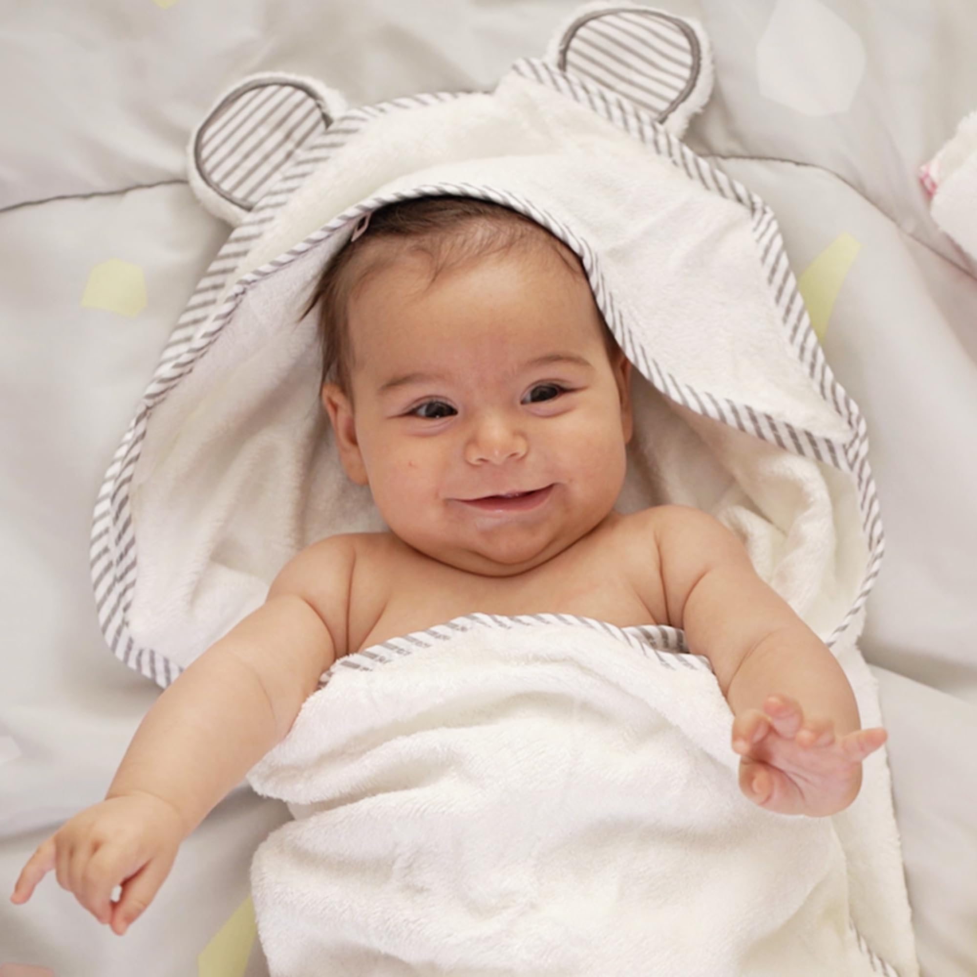San Francisco Baby hooded towel white folded neatly to illustrate easy storage.