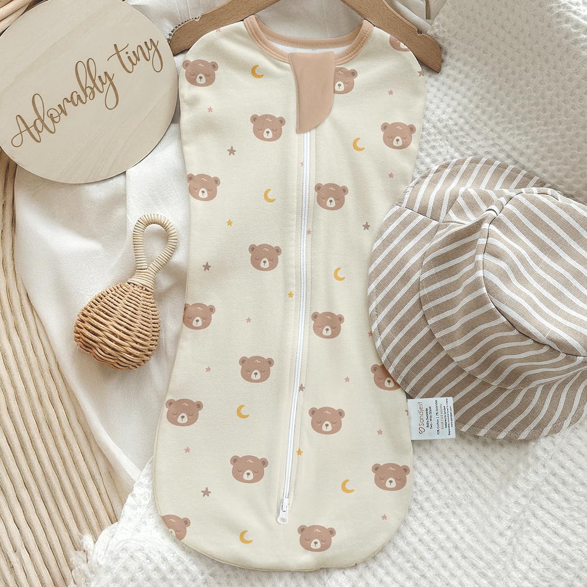 SANDJEST swaddle in-use shows secure fit with arm-in zipper for quick changes