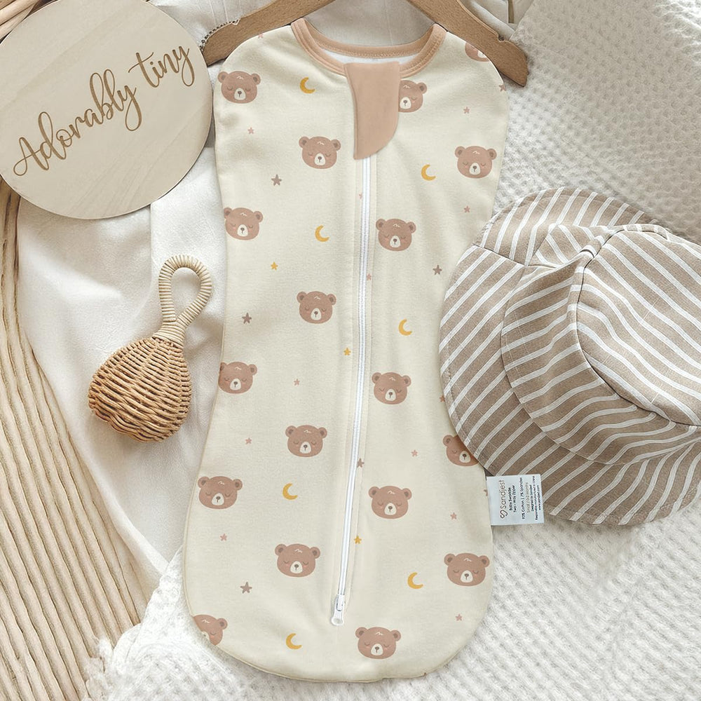SANDJEST swaddle in-use shows secure fit with arm-in zipper for quick changes