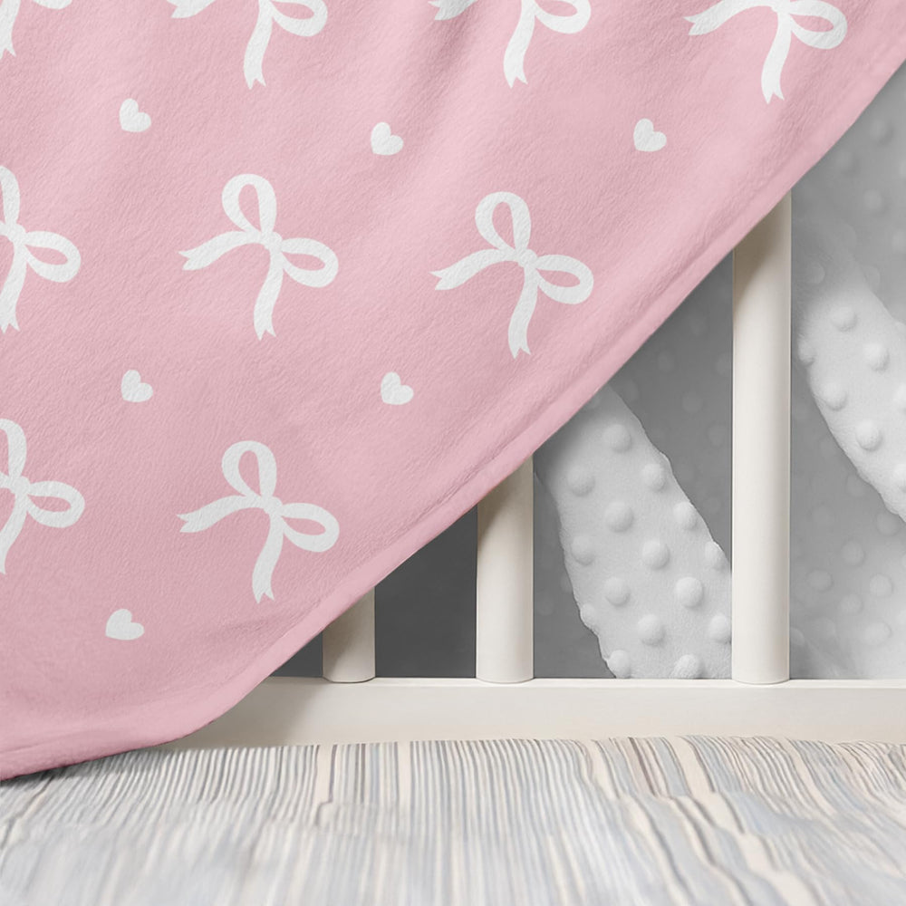 SANDJEST Bow Minky blanket in baby bed offers breathable warmth year-round