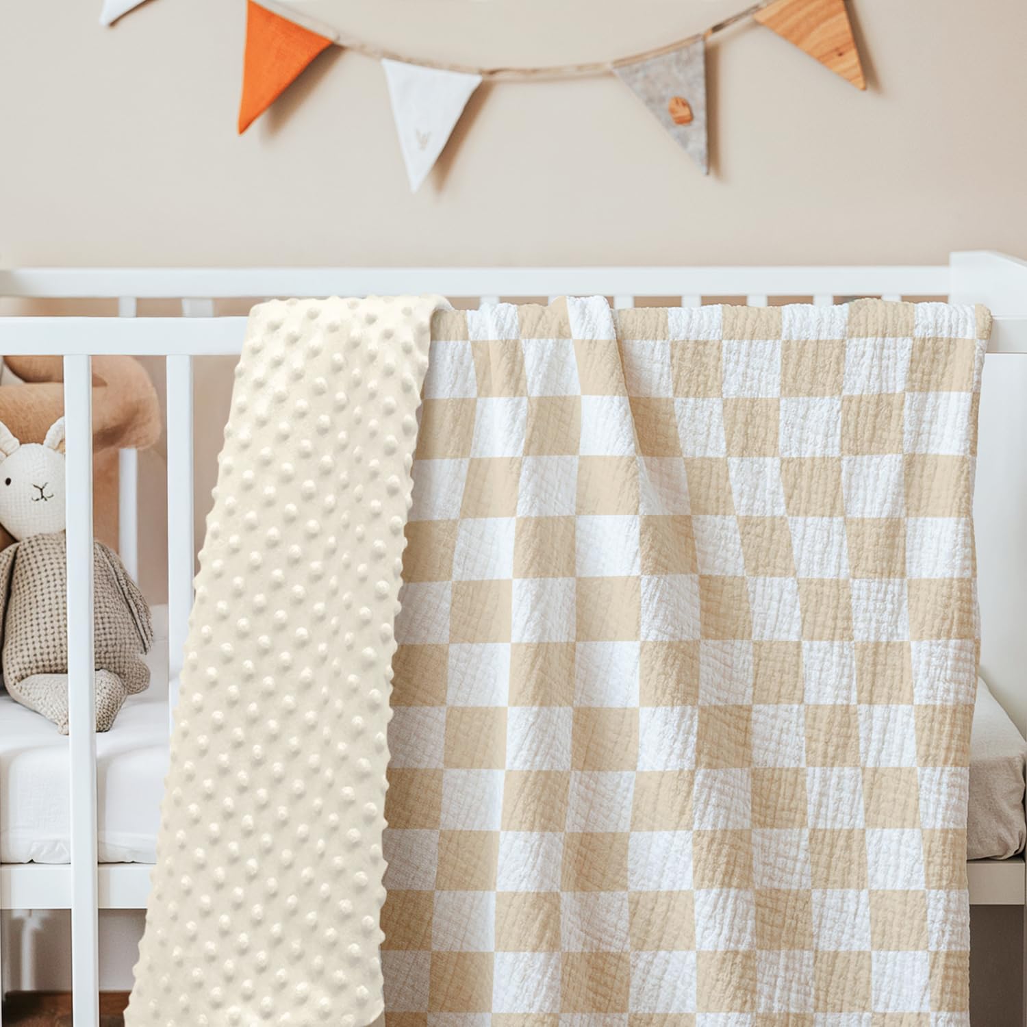 SANDJEST soft-checkered nursery blanket adds charming color to any space.