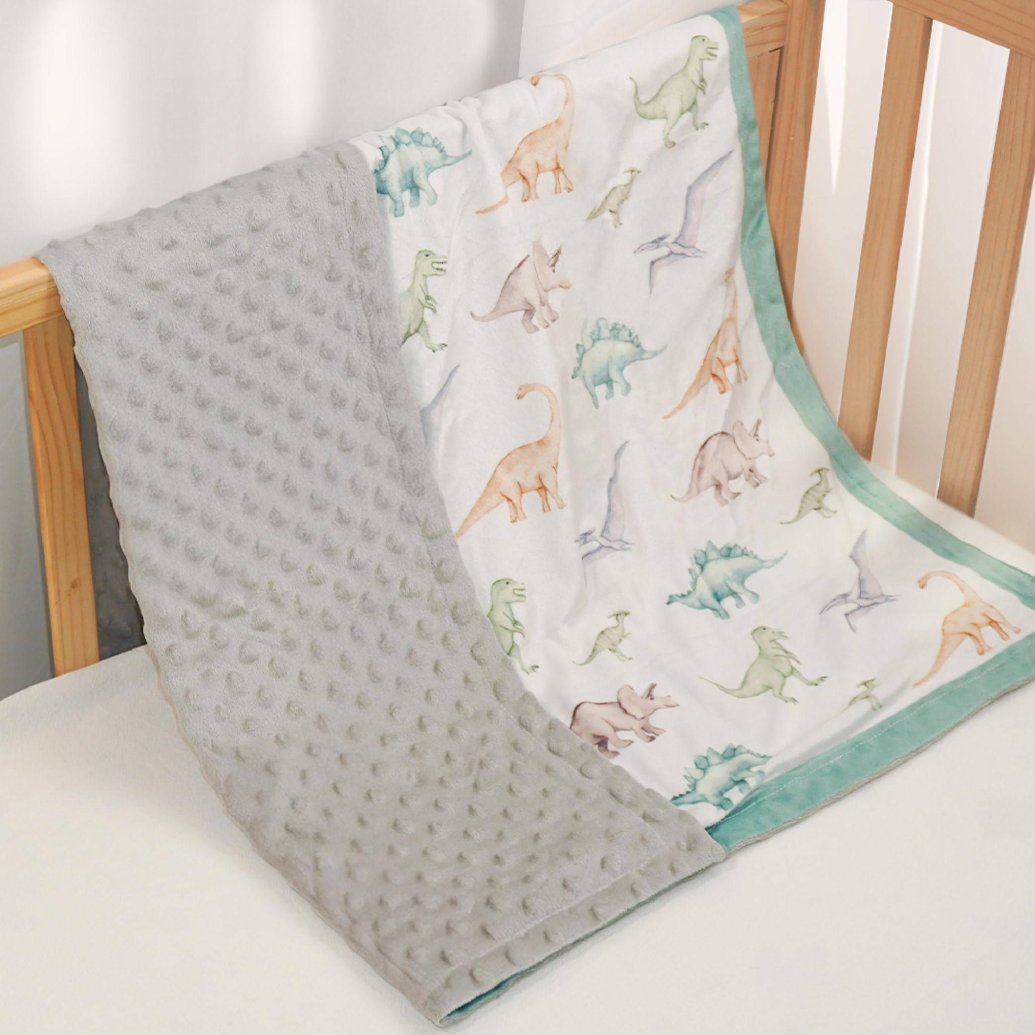 SANDJEST dinosaurs blanket with 3D dotted surface for tactile comfort.