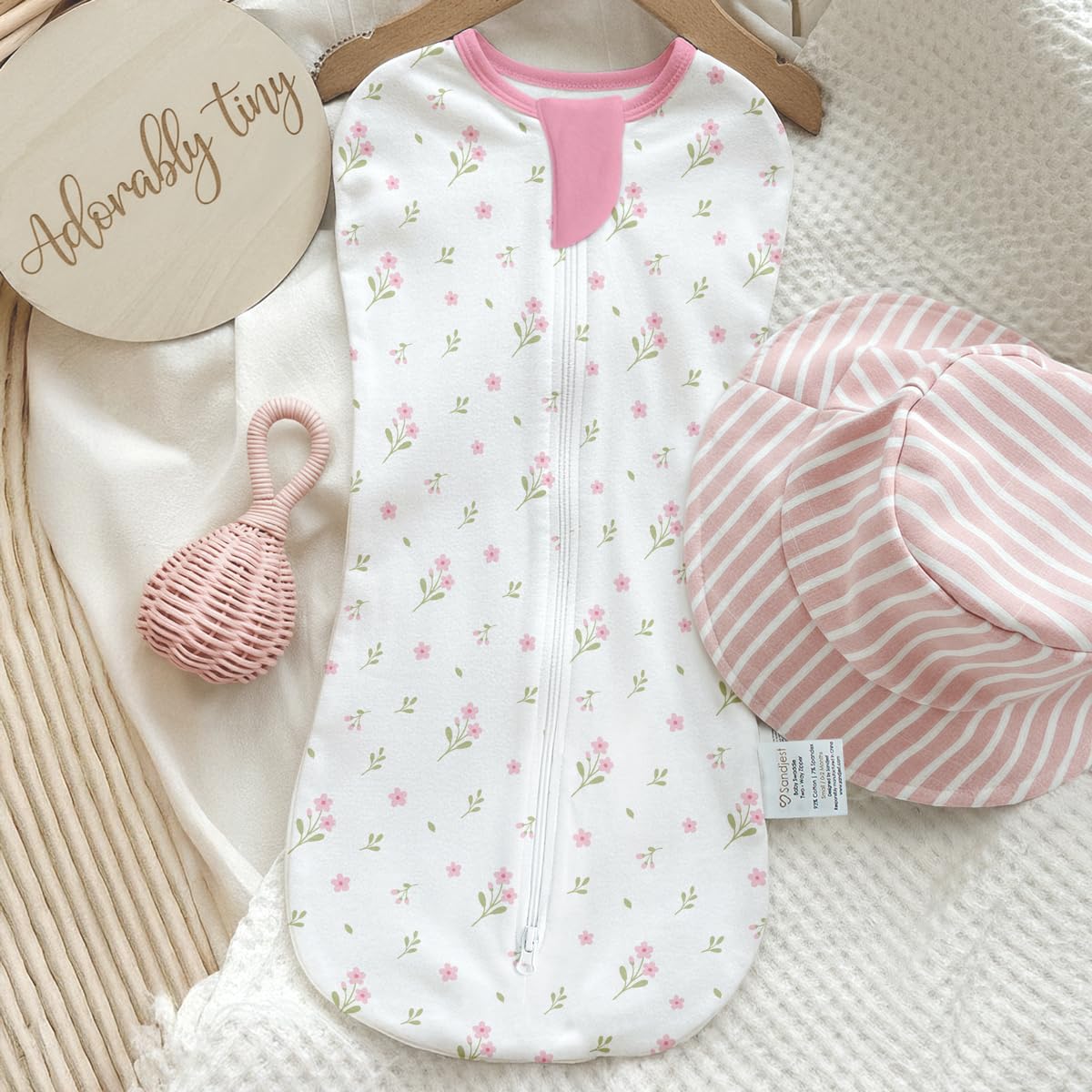 SANDJEST pack-two-swaddles image reveals two colorways in floral and checkered patterns.