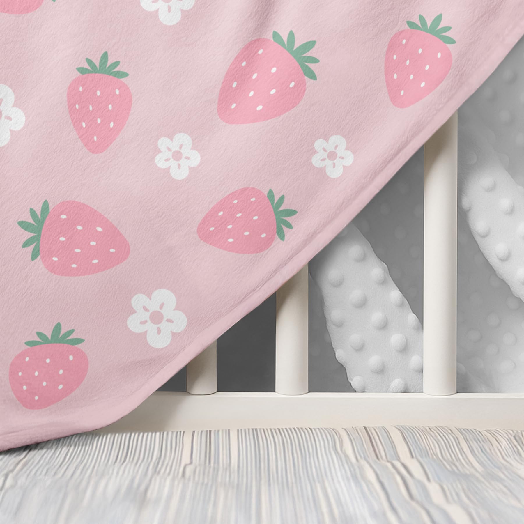 SANDJEST Strawberry Minky Blanket changing pad — soft surface for quick cleanups.