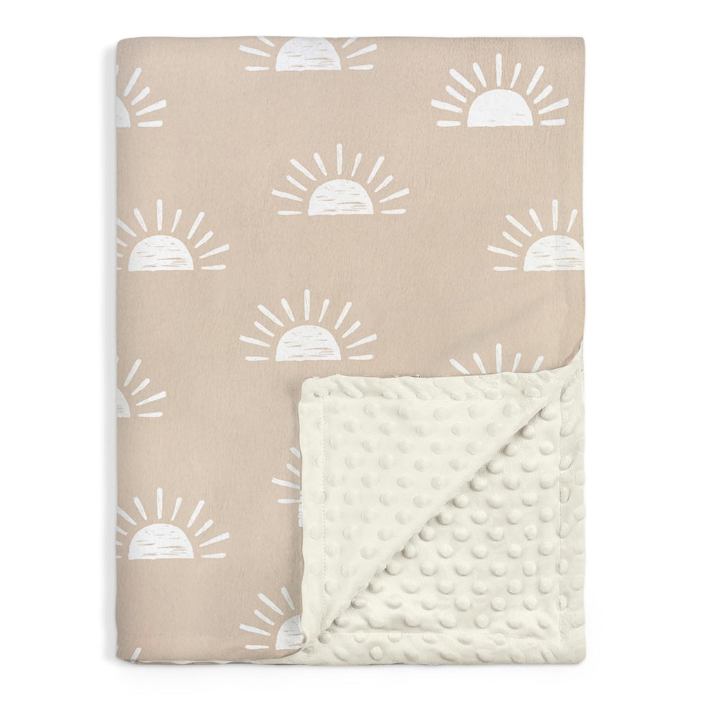 SANDJEST Sun Minky blanket flatlay shows portable travel size for quick naps.