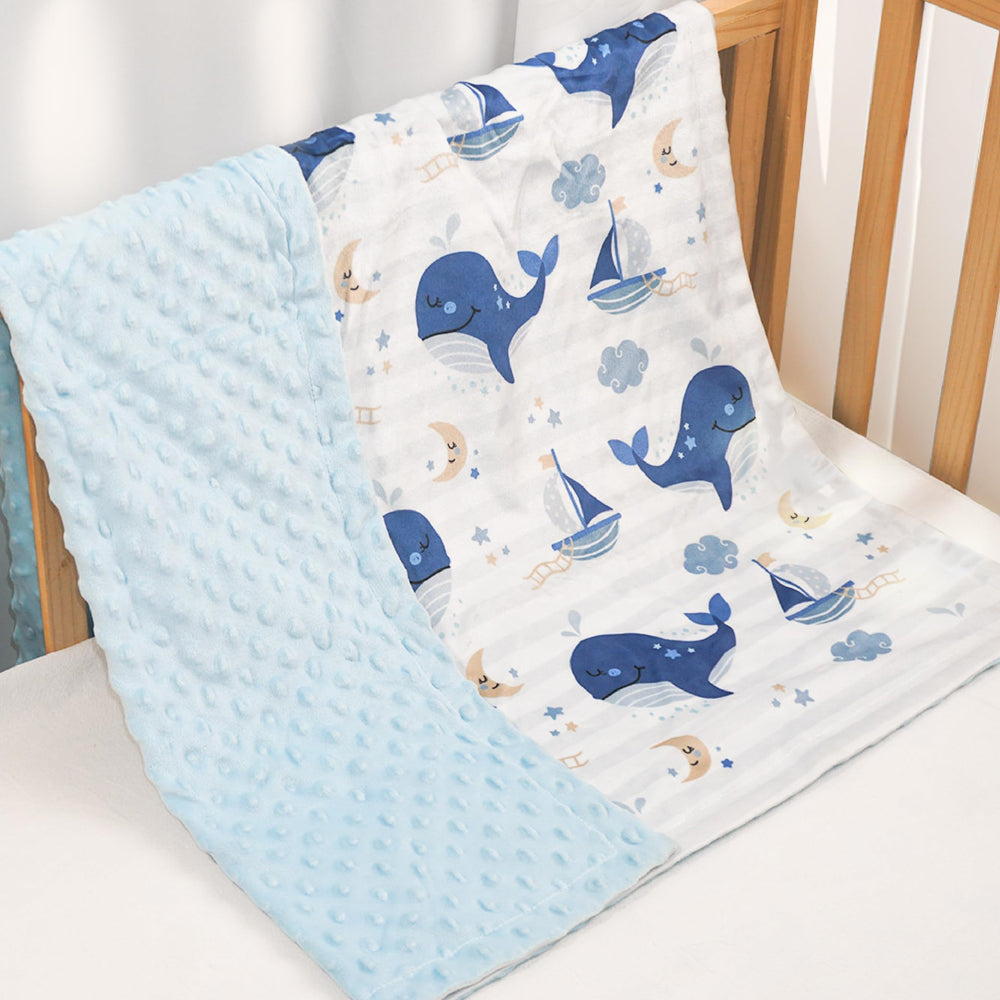 SANDJEST Whale Kid Blanket on a crib for nap-time comfort.