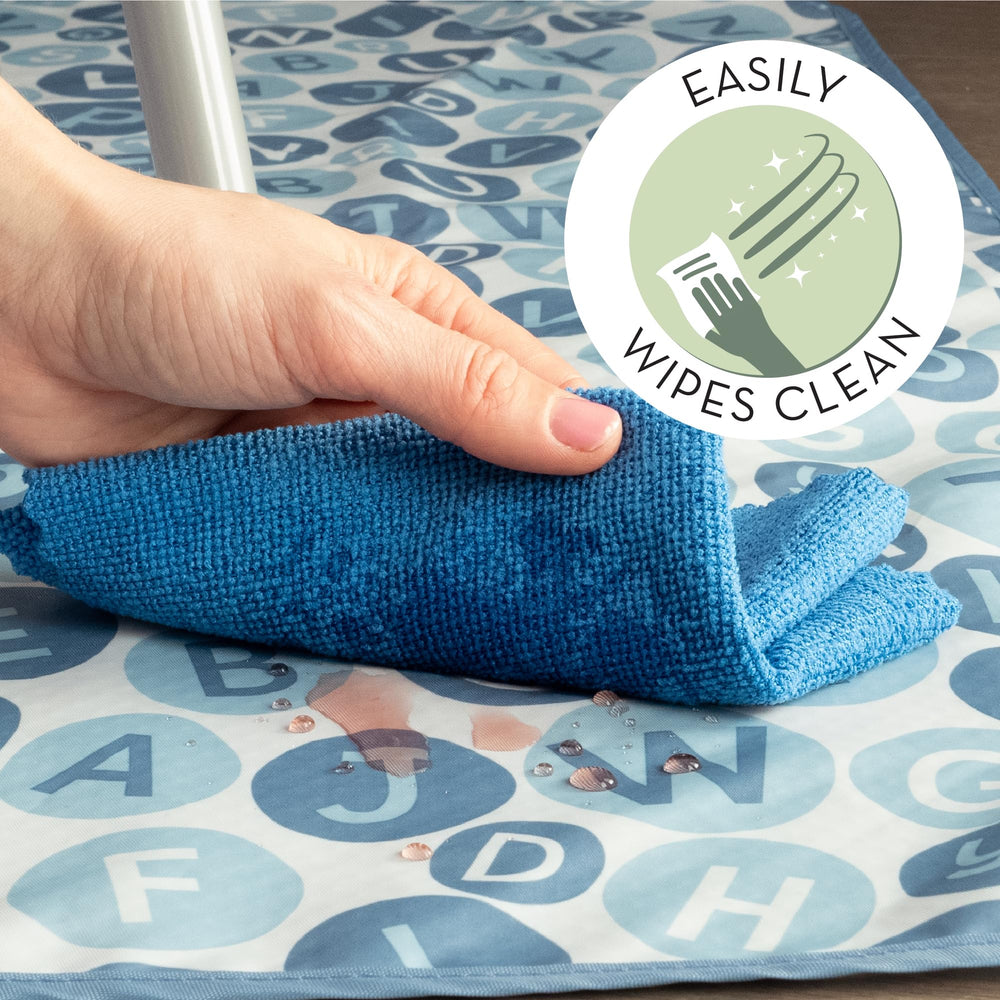 S&T INC 42x42 blue alphabet splat mat laid on the kitchen floor.