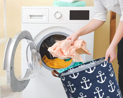 Sanjiaofen Kids Hamper navy anchor pattern adds nautical decor to a kid's room.