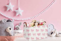 Sanjiaofen storage basket in a playroom organizes books and crafts.
