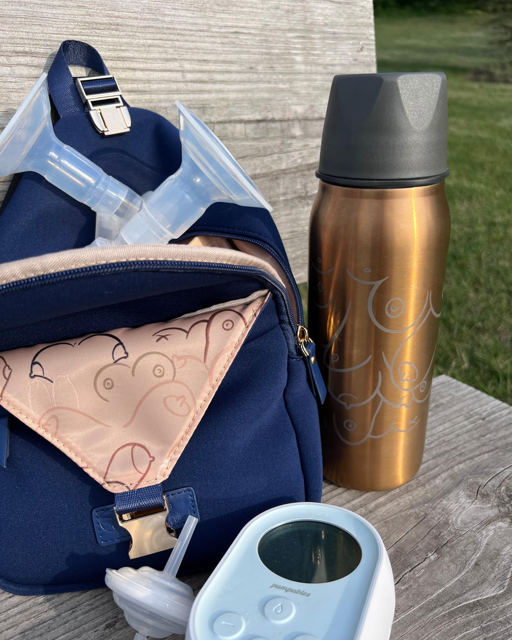 Allie Sling Bag insulated pocket keeps milk chiller or bottles cool.