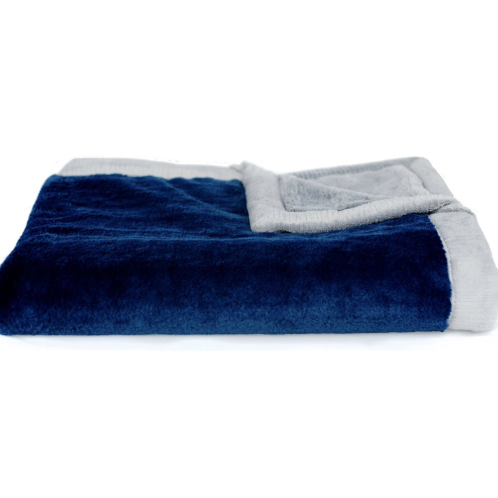 SARANONI navy-gray receiving blanket draped over crib, enriching nursery styling with warmth.