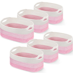Sawysine six-piece pink and white cotton rope basket set with handles for tidy living room storage.