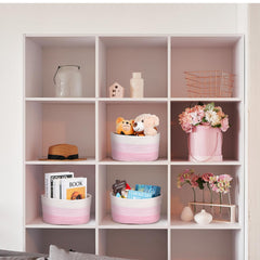 Sawysine boho-style storage baskets in patches of pink and white for blankets and crafts.