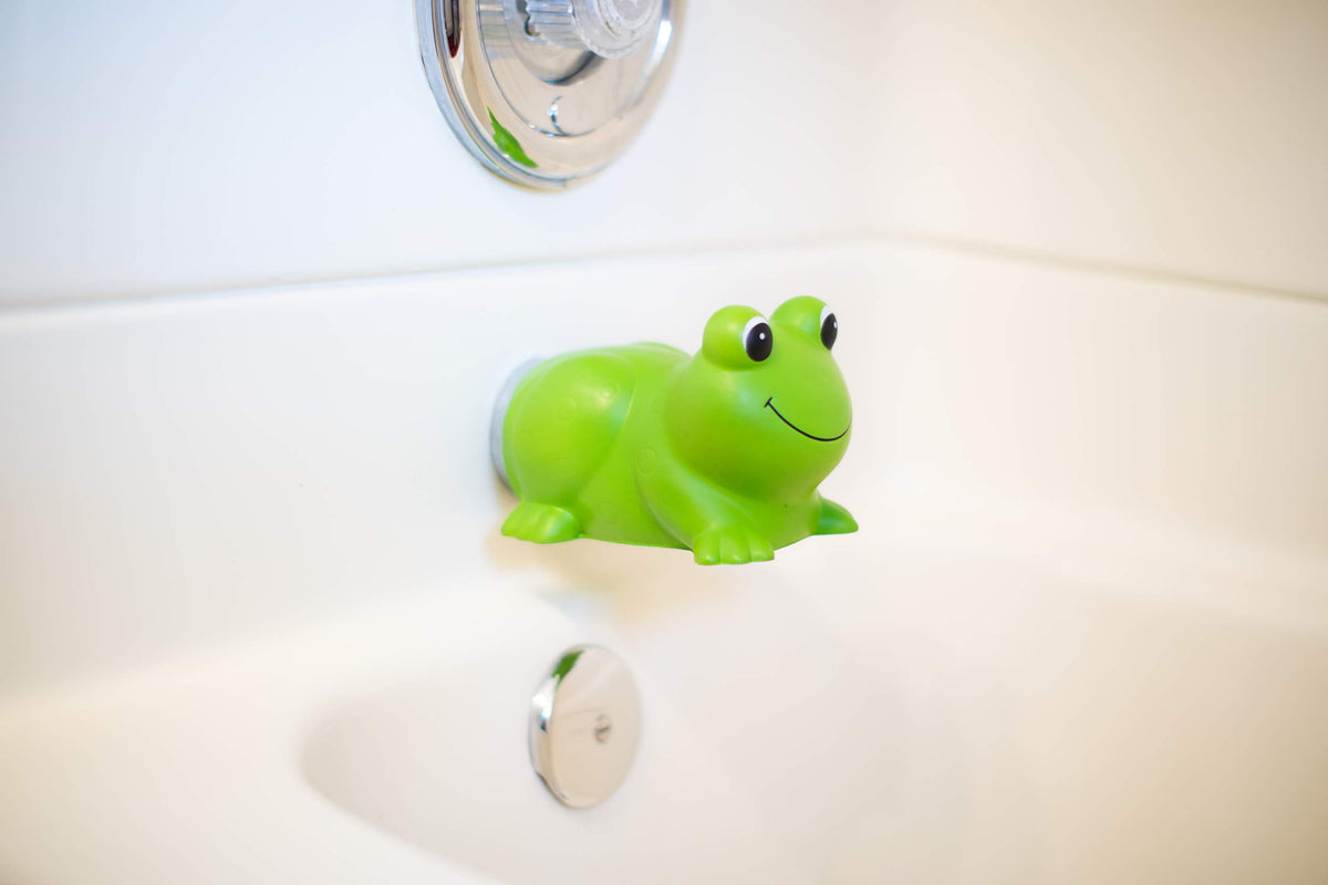 S.C. Products Ultra Soft Faucet Guard frog front view protects kids from bumps during bath.