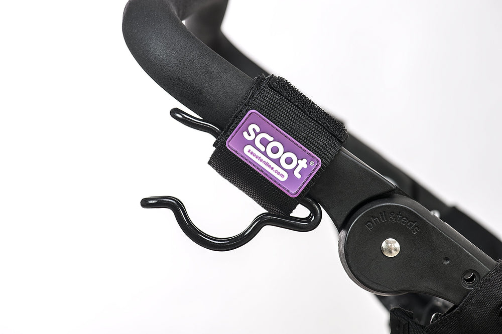 SCOOT The Ultimate Buggy Hook on handlebars demonstrates secure two-hook configuration for versatile carrying