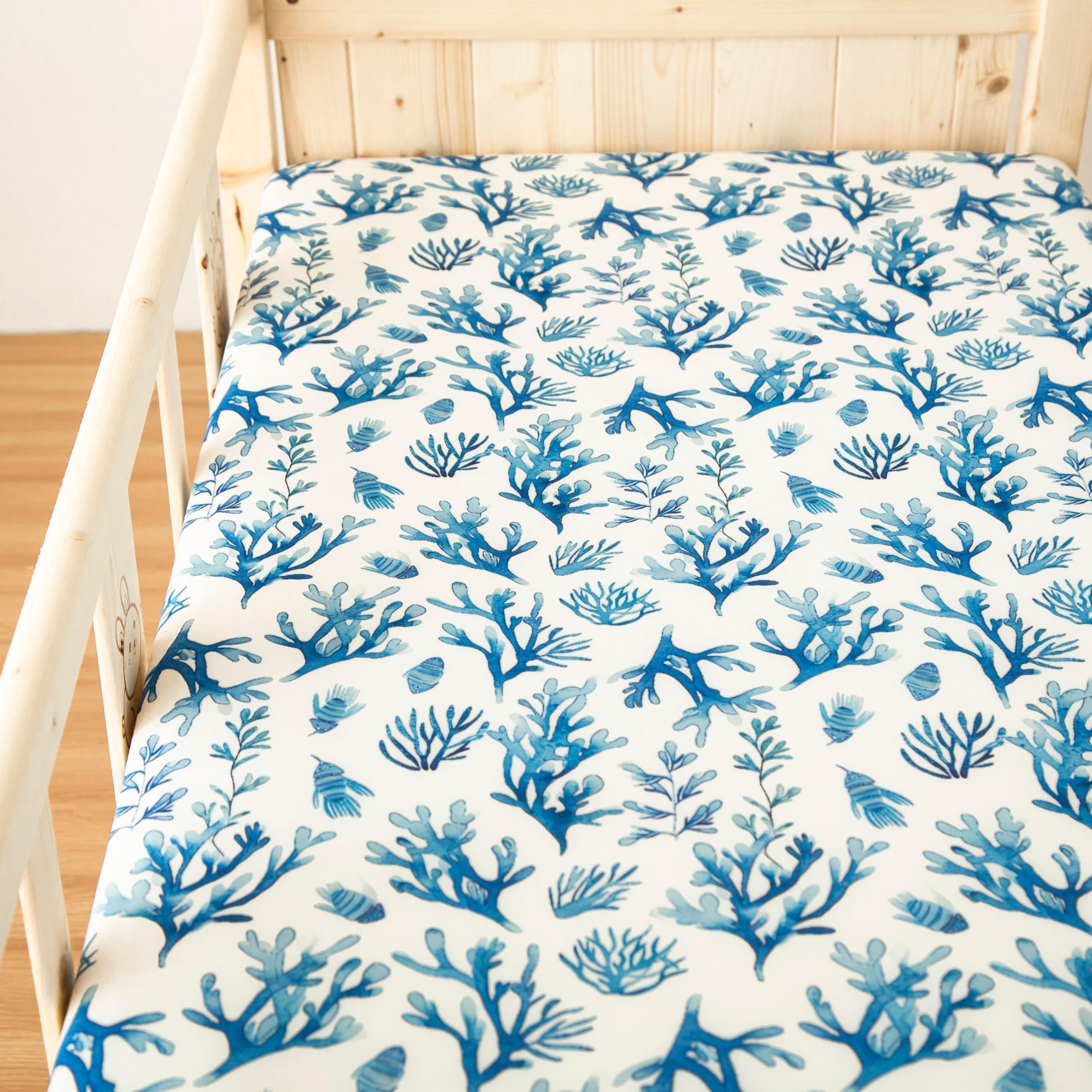 SDIII ocean styling pairs with navy and white nursery decor.