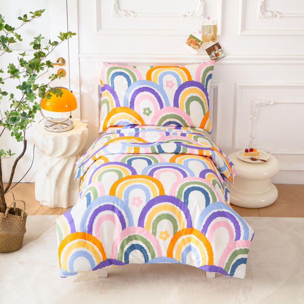 SDIII rainbow comforter — cozy warmth for toddler bedtimes.