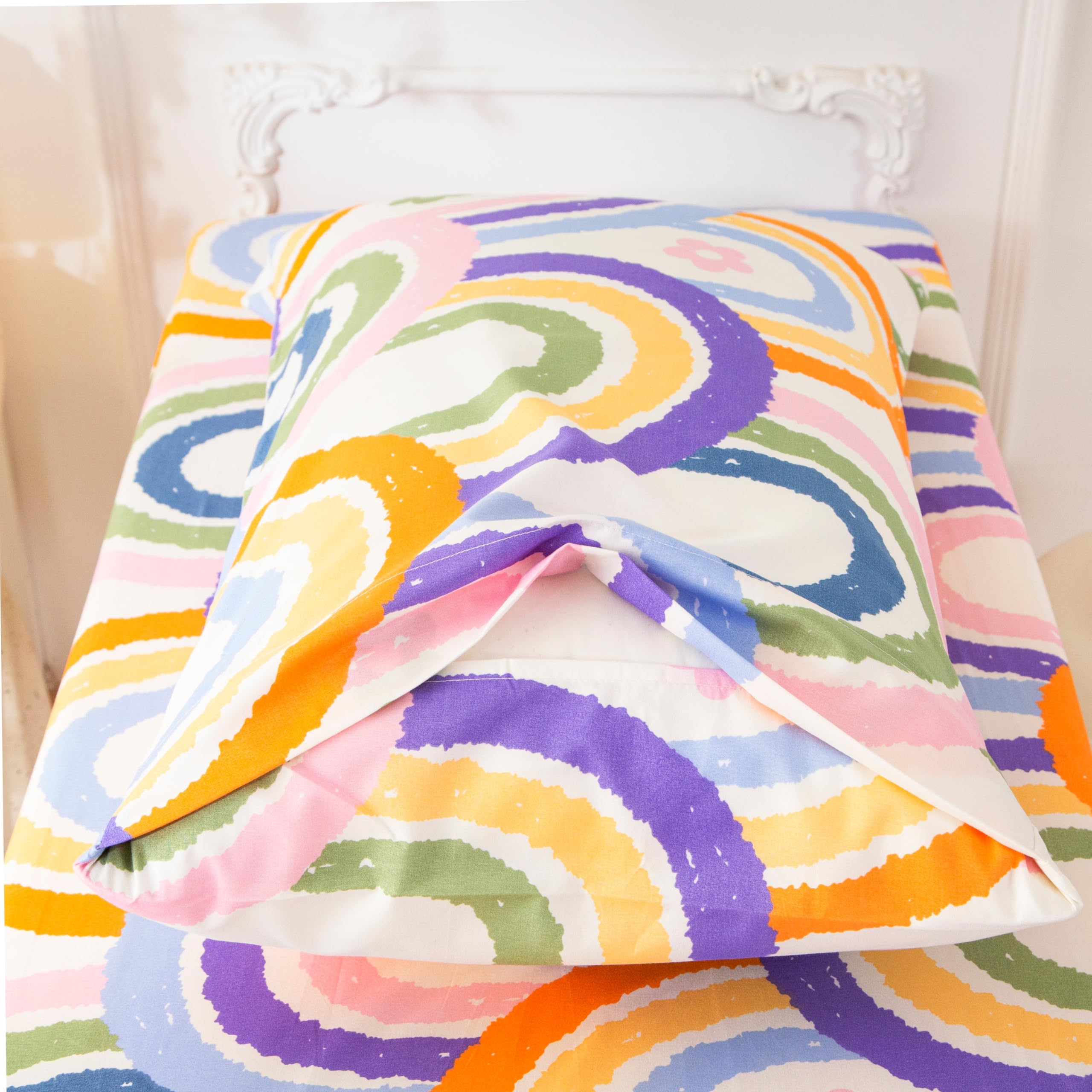 SDIII rainbow bedding on toddler bed — easy care for parents.