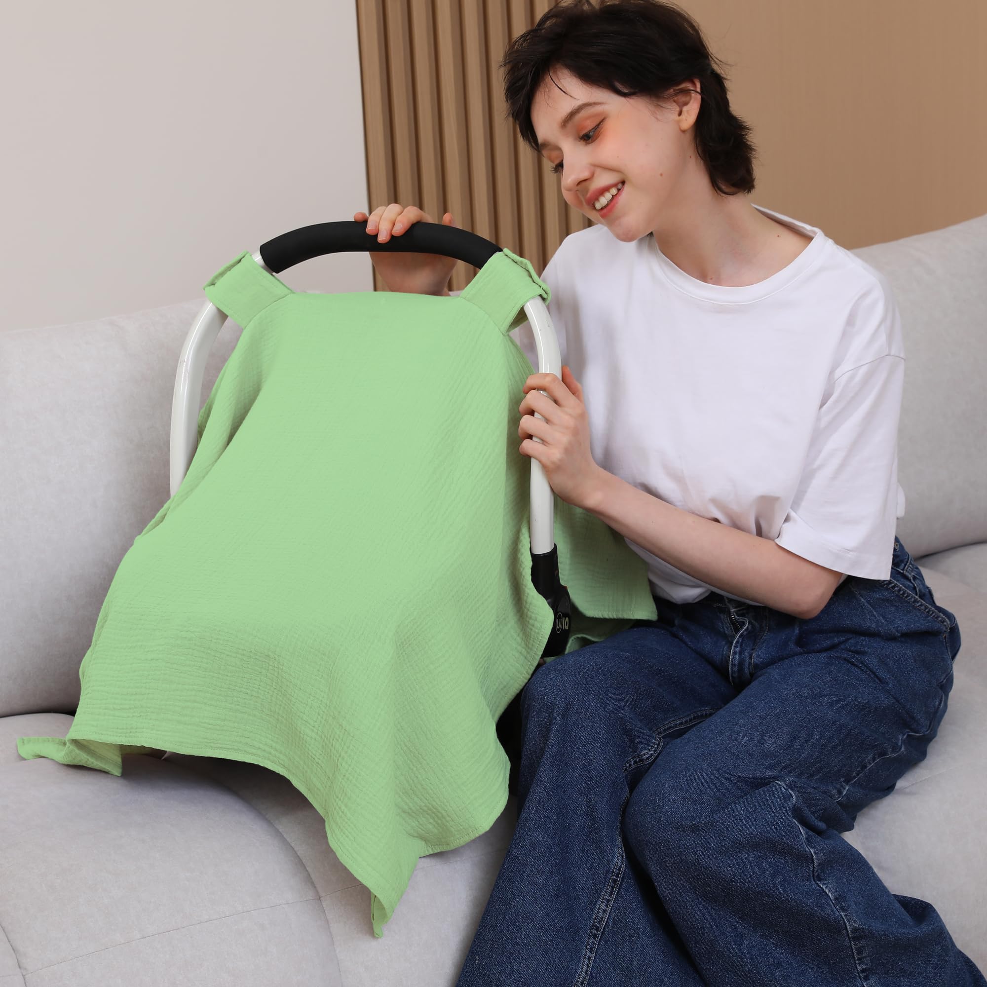 Seejoy city green stroller cover folded for compact storage during outings.