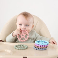 Seposeve ring teether star texture massages gums for comfort.