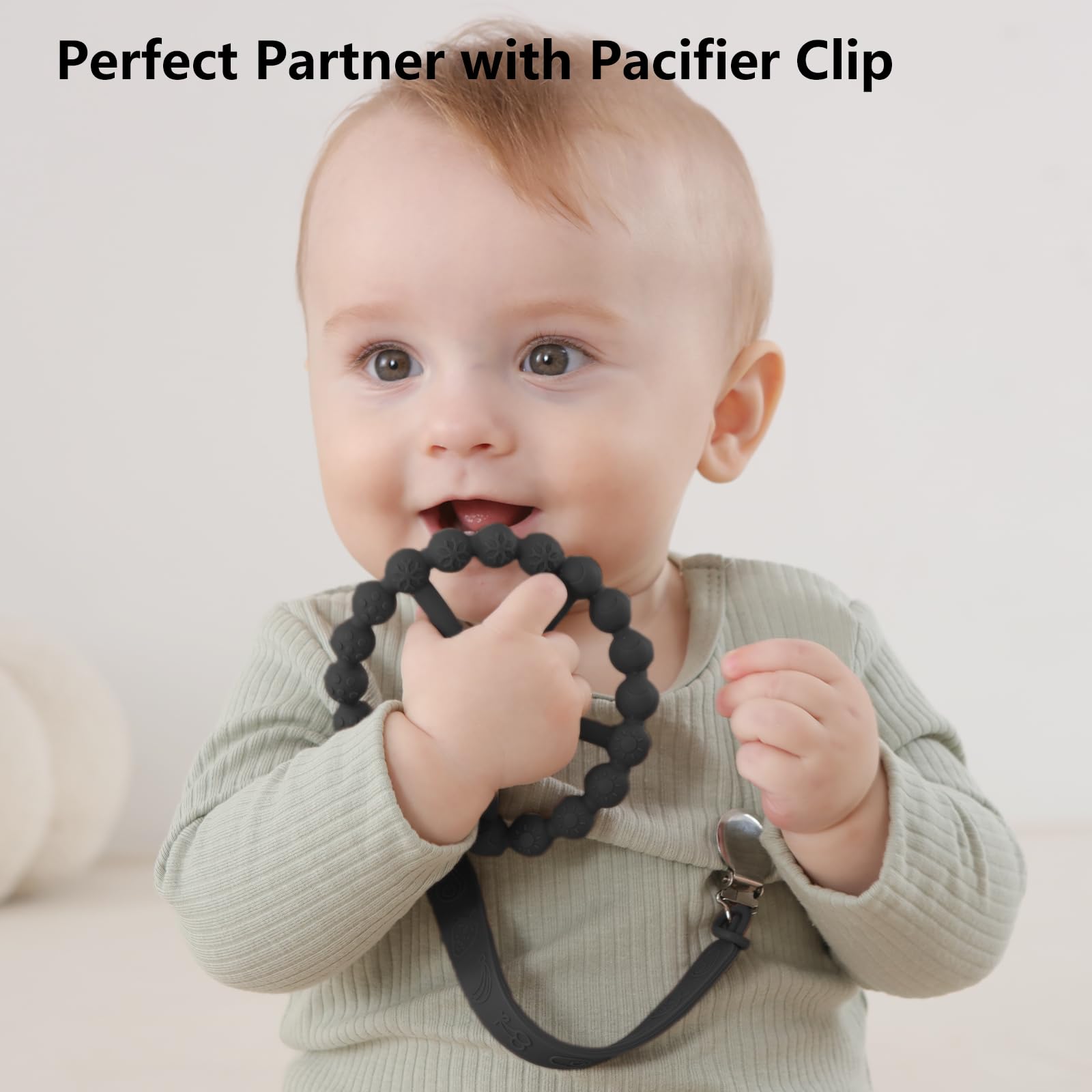 Seposeve teether with pacifier clip demonstrates secure attachment to clothing