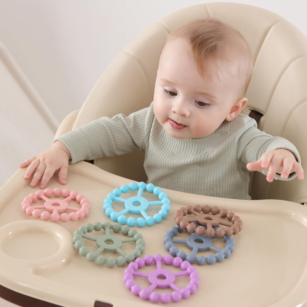 Seposeve teether in light purple green blue offers visually engaging play and exploration.