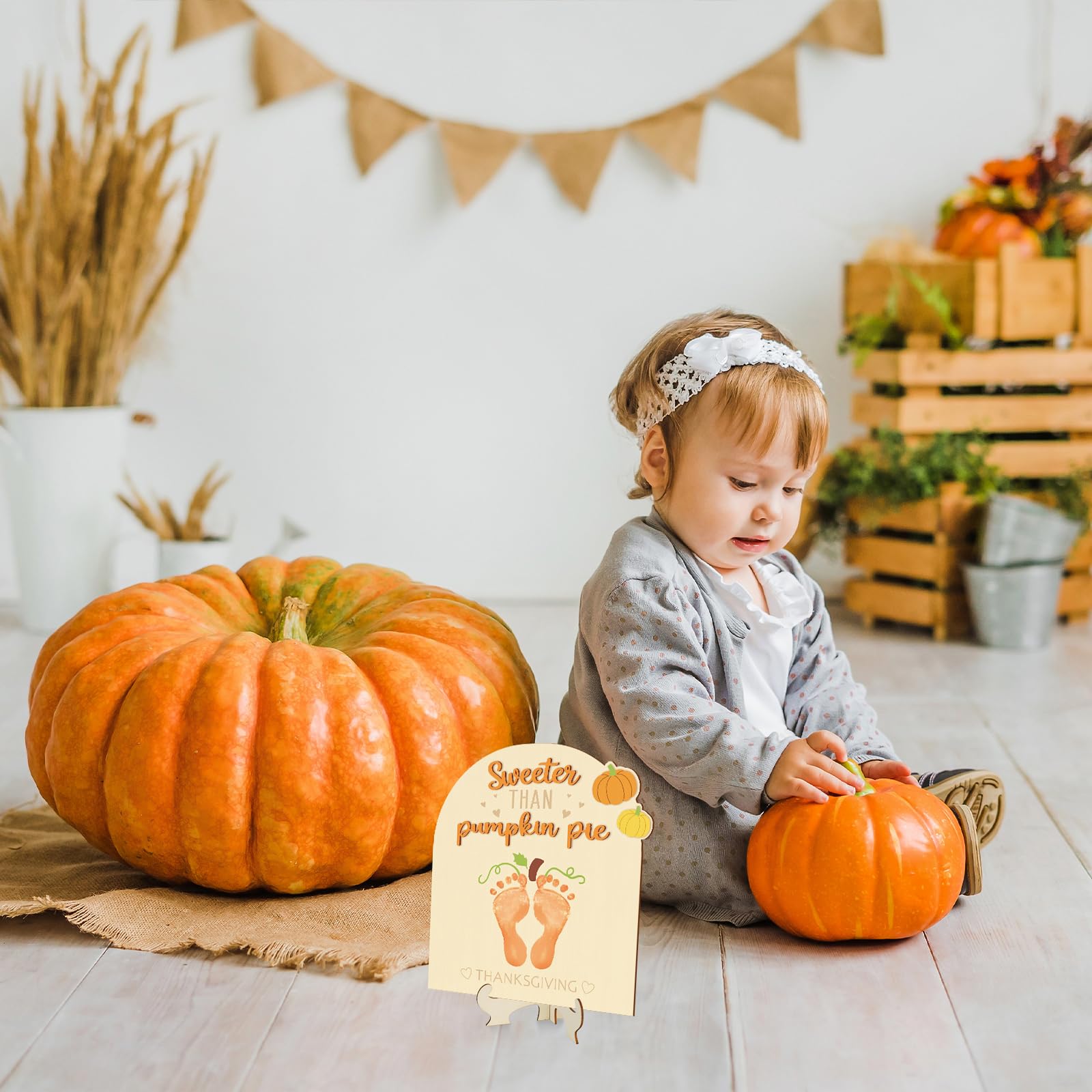 Sereliy newborn photoshoot pumpkin sign with soft lighting