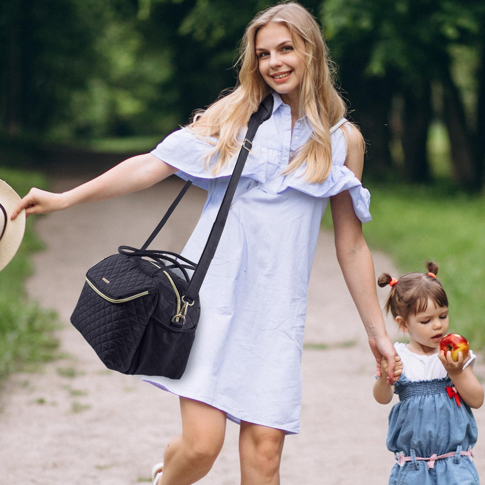 SFYBYHEART travel bag shown in airport scene for on-the-go moms.