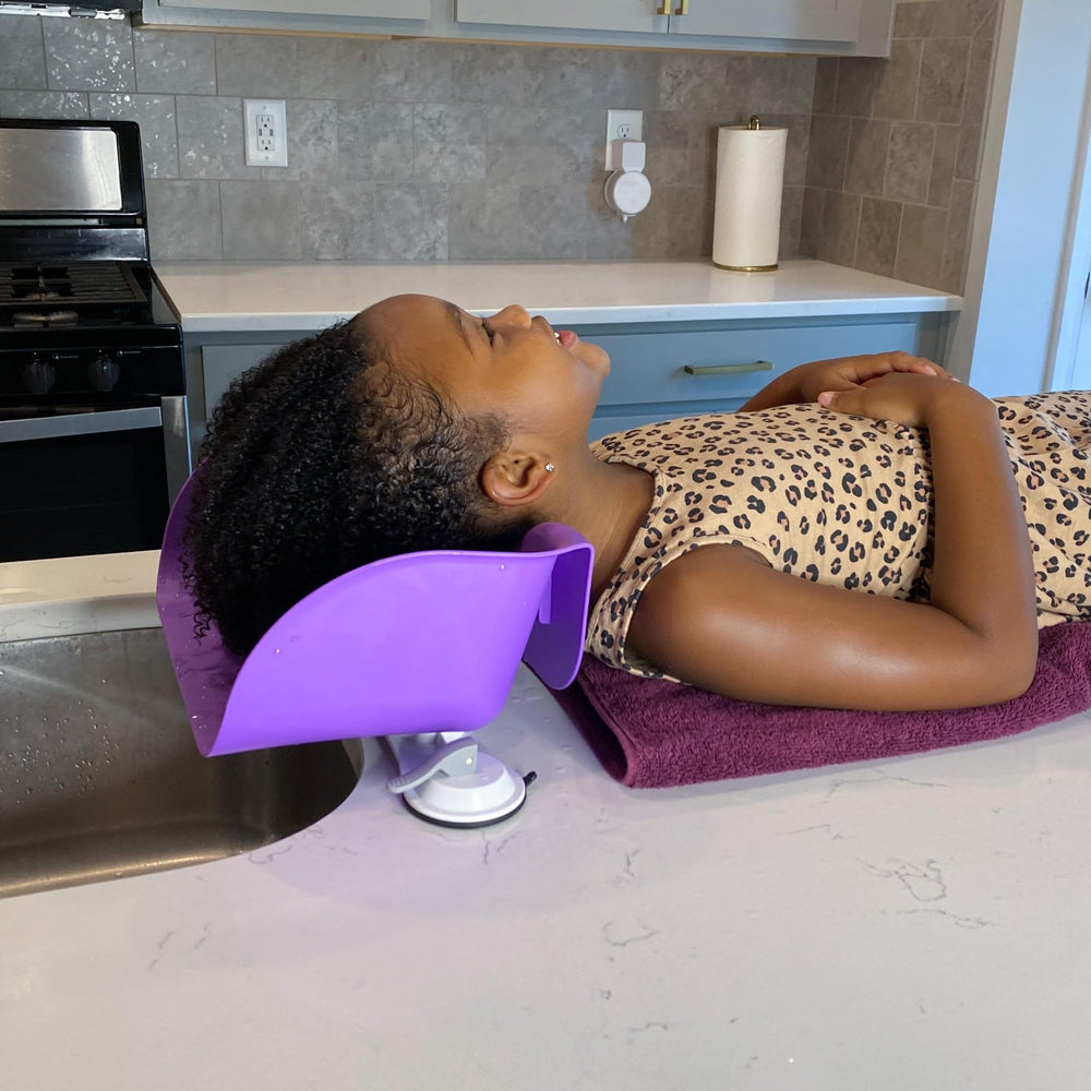 Shampoo Buddy suction cups attach to flat surfaces for stable rinsing