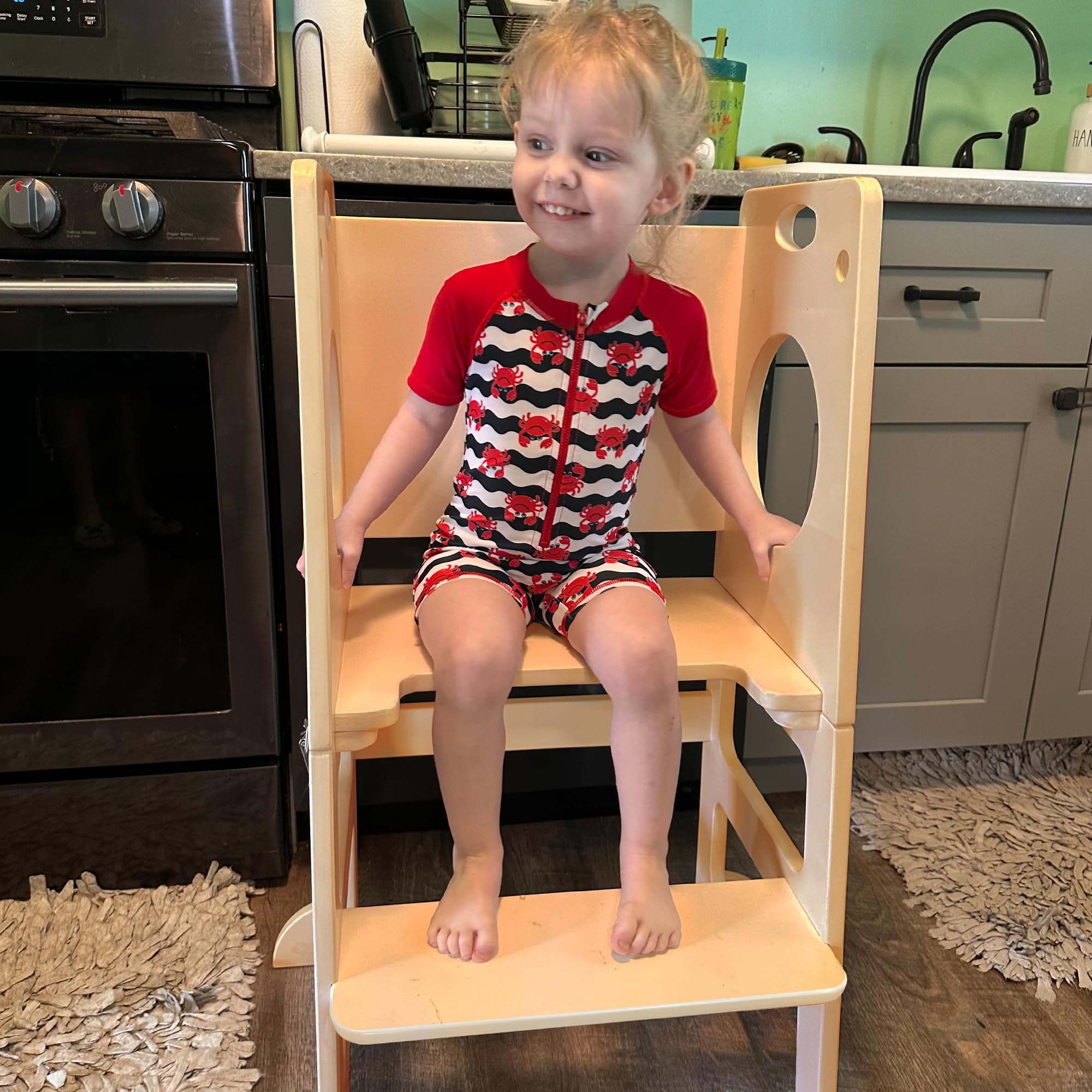 SHWWQUE toddler tower features side safety rails for secure climbing.