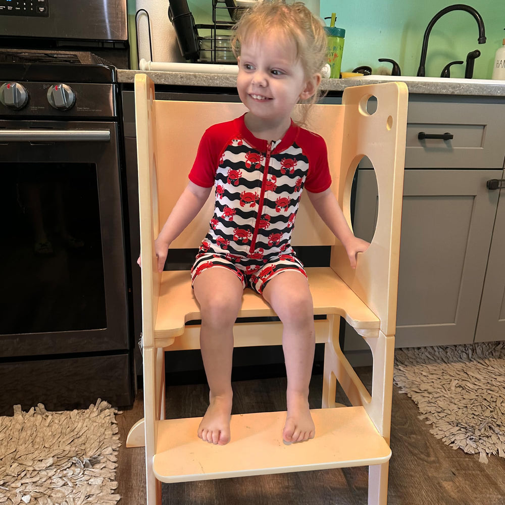 SHWWQUE toddler tower features side safety rails for secure climbing.