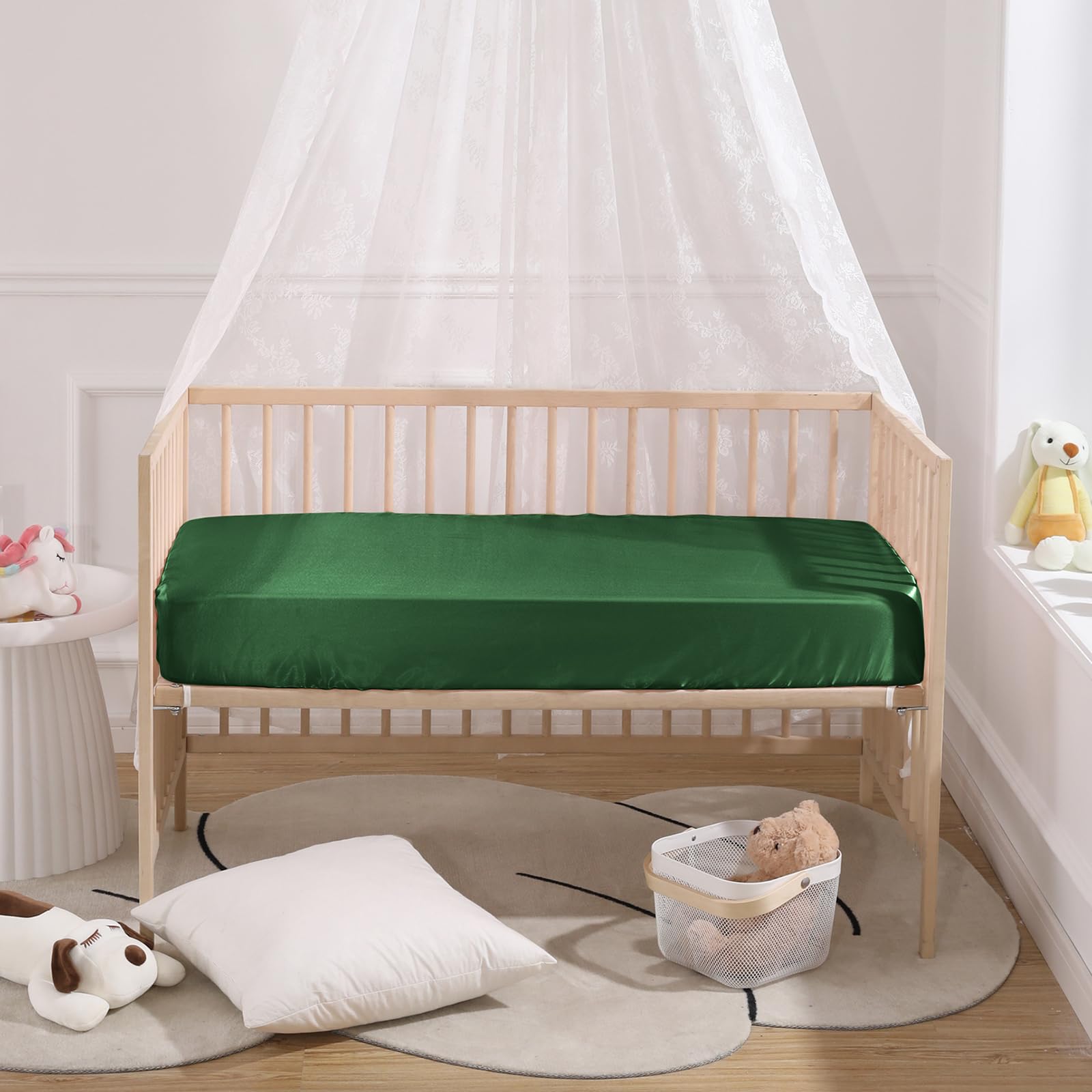 SiinvdaBZX satin crib sheets on crib mattress in real-life setup.
