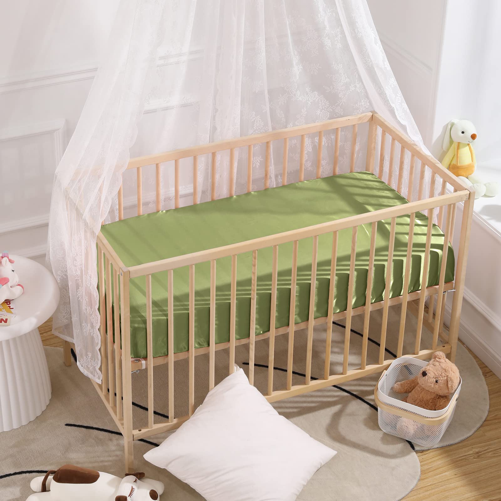 SiinvdaBZX satin mini crib sheets pictured on a baby crib, soft and cool to touch.