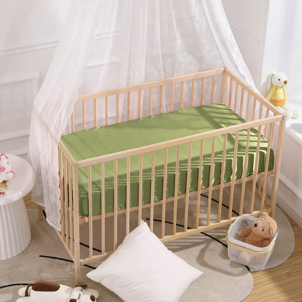 SiinvdaBZX satin mini crib sheets pictured on a baby crib, soft and cool to touch.