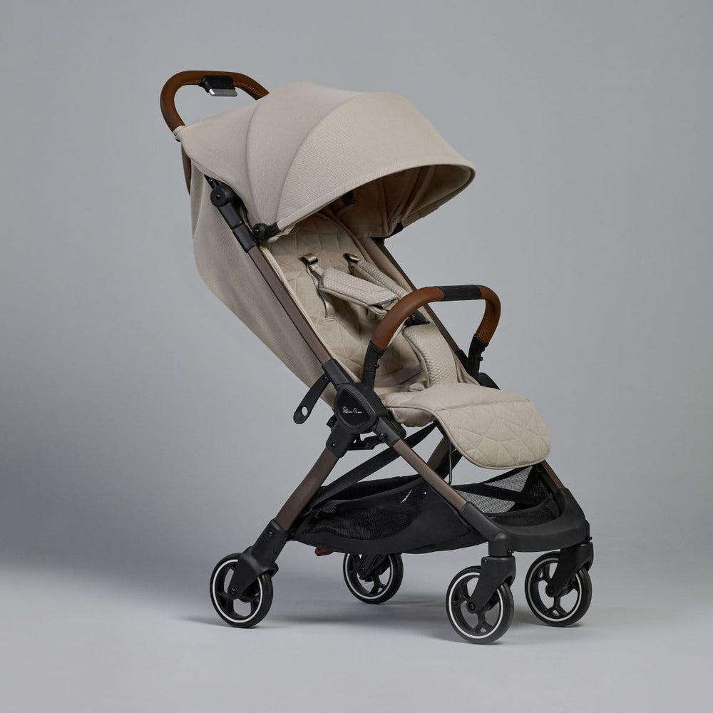 Silver Cross Clic lie-flat seat in latte supports newborn comfort for extended strolls.