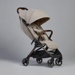 Silver Cross Clic lie-flat seat in latte supports newborn comfort for extended strolls.