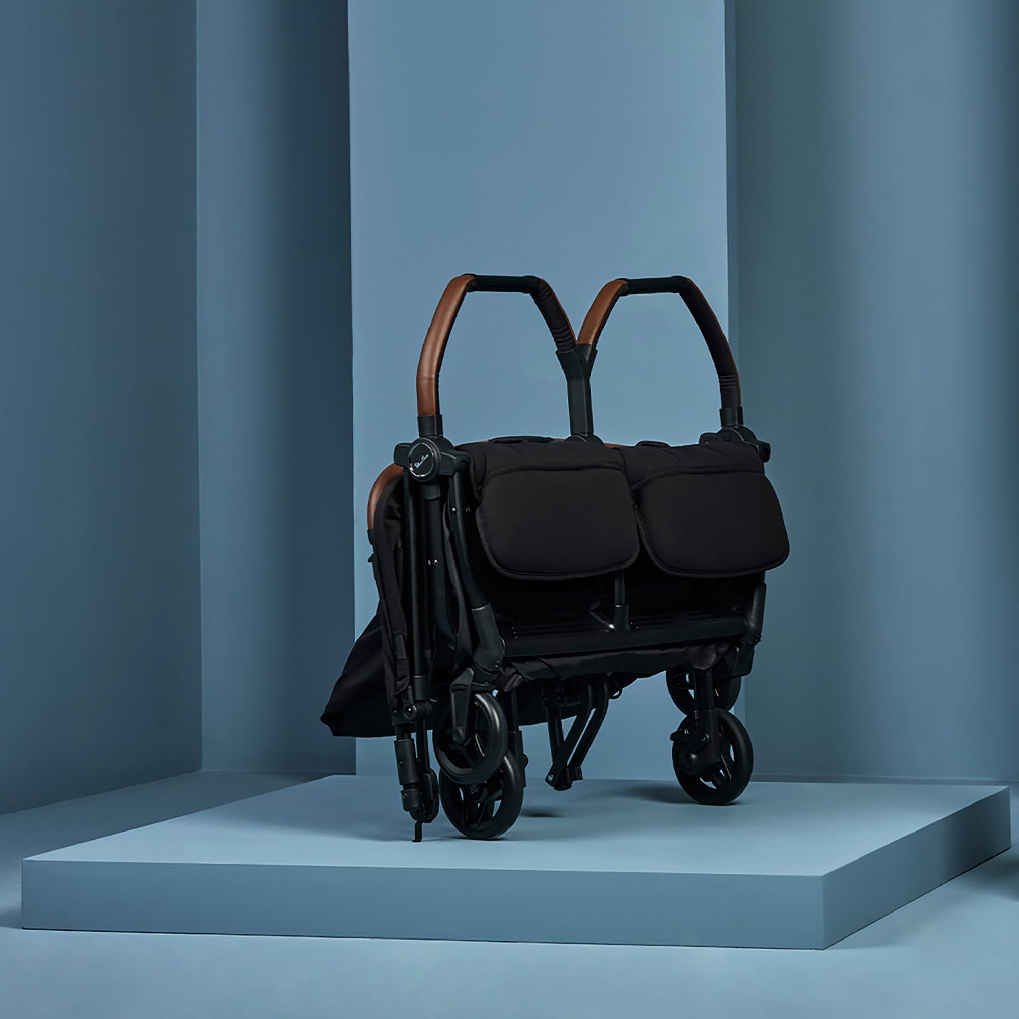 Silver Cross Jet Double folded self-stand demonstrates compact storage solution.