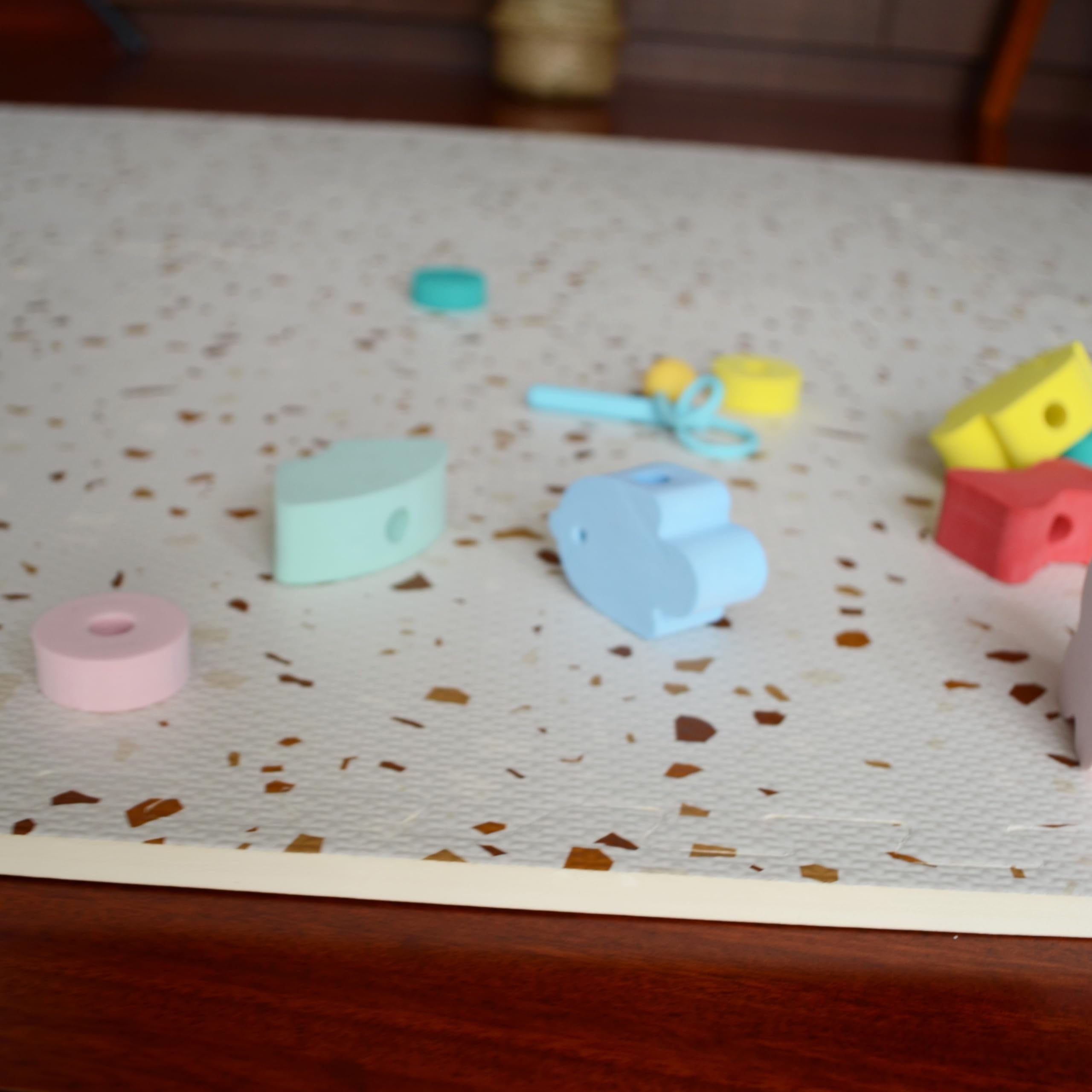 Simple Kid Co terrazzo play mat blends with nursery decor while offering a soft play zone.