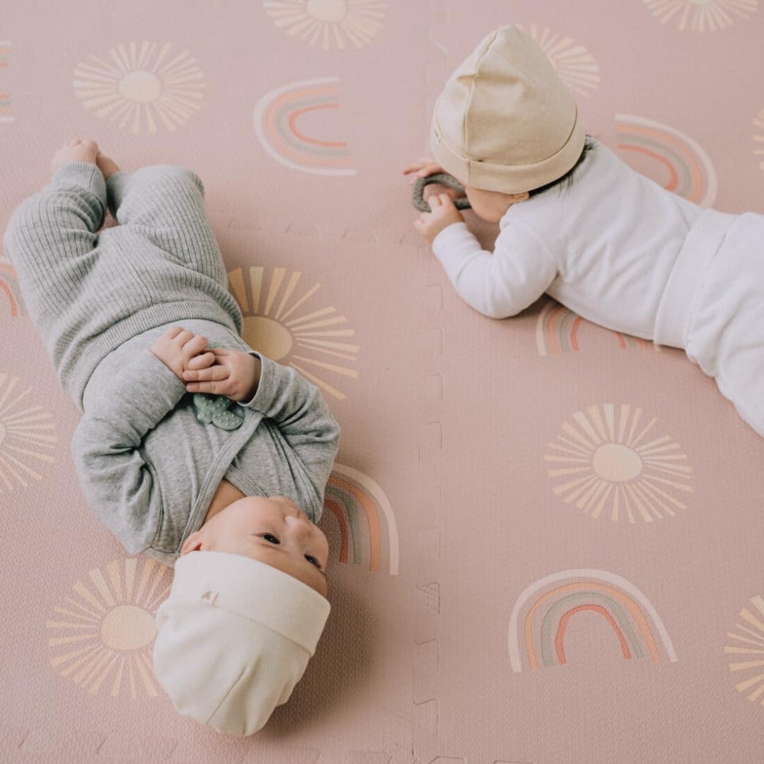 Simple Kid Co. Play Mat dusty rose Sunset Rainbows design adds stylish, kid-friendly decor.