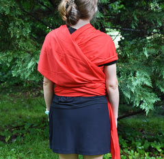 Simply Essential Solutions baby wrap positioning baby facing in or out shows versatile carry options.