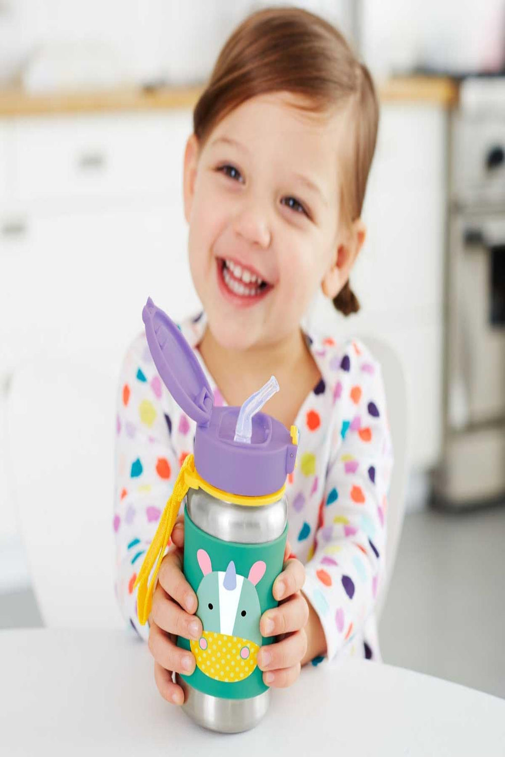 Skip Hop Unicorn sippy bottle shows 12 oz capacity and easy transport.